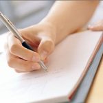 Hand writing in journal