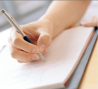 Hand writing in journal