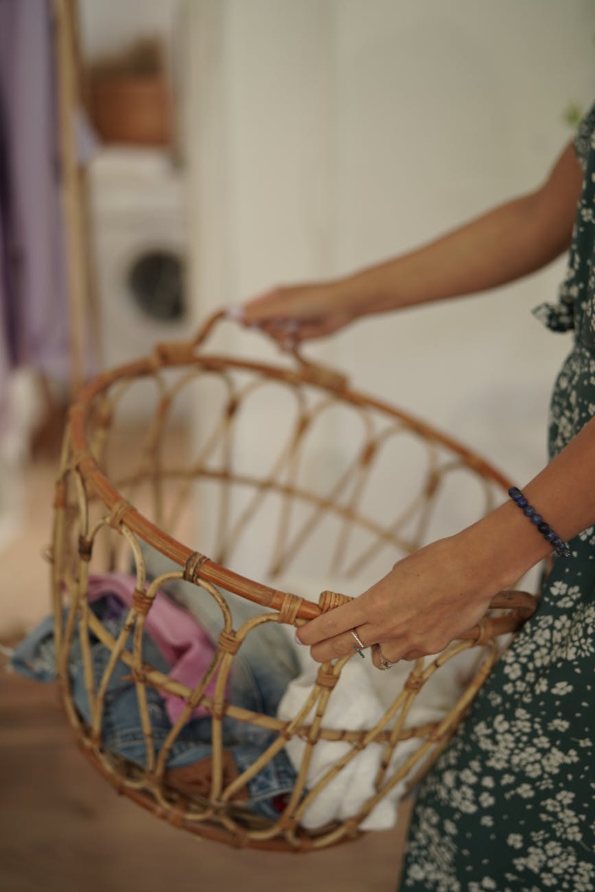 close up shot of a person holding a woven basket